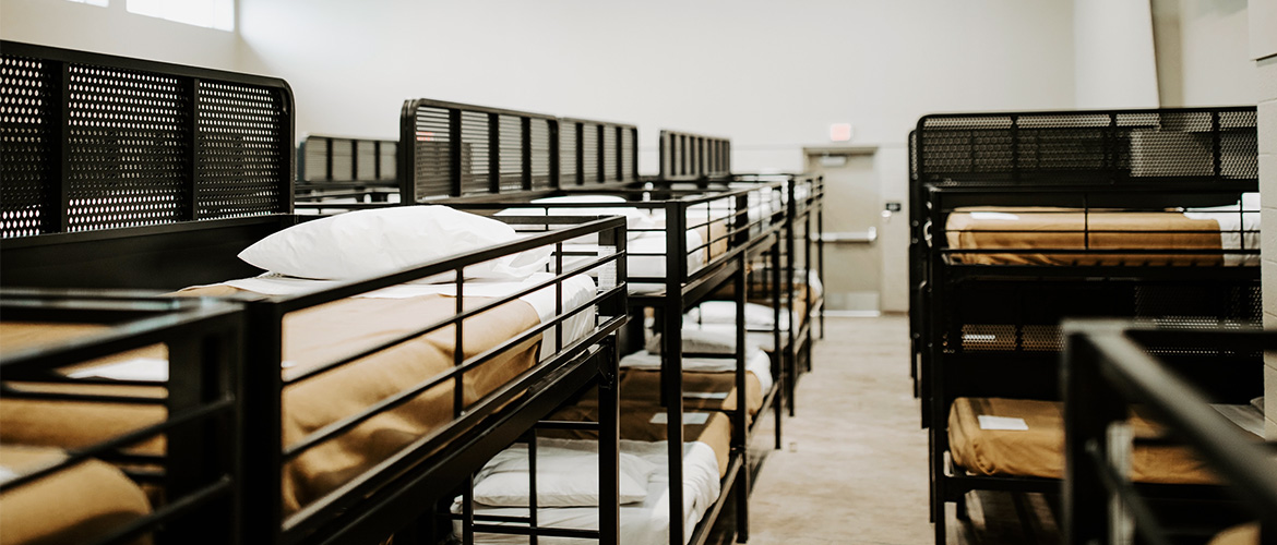bunk beds lined up in a large room