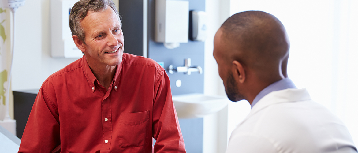 Man talks to his doctor during an appointment