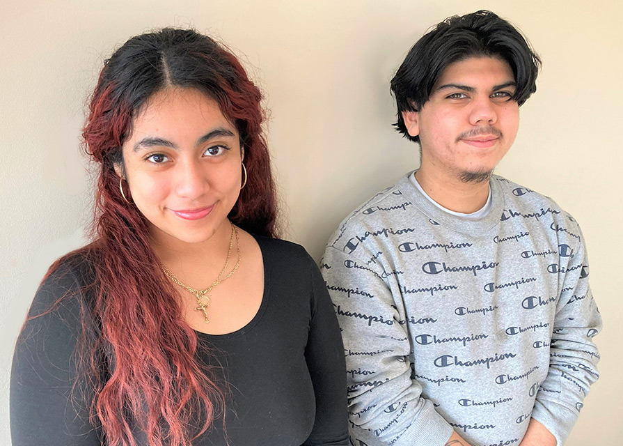 A young woman and young man smiling