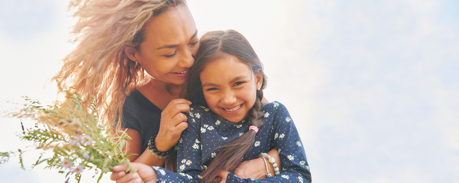 Mother and daughter with flowers