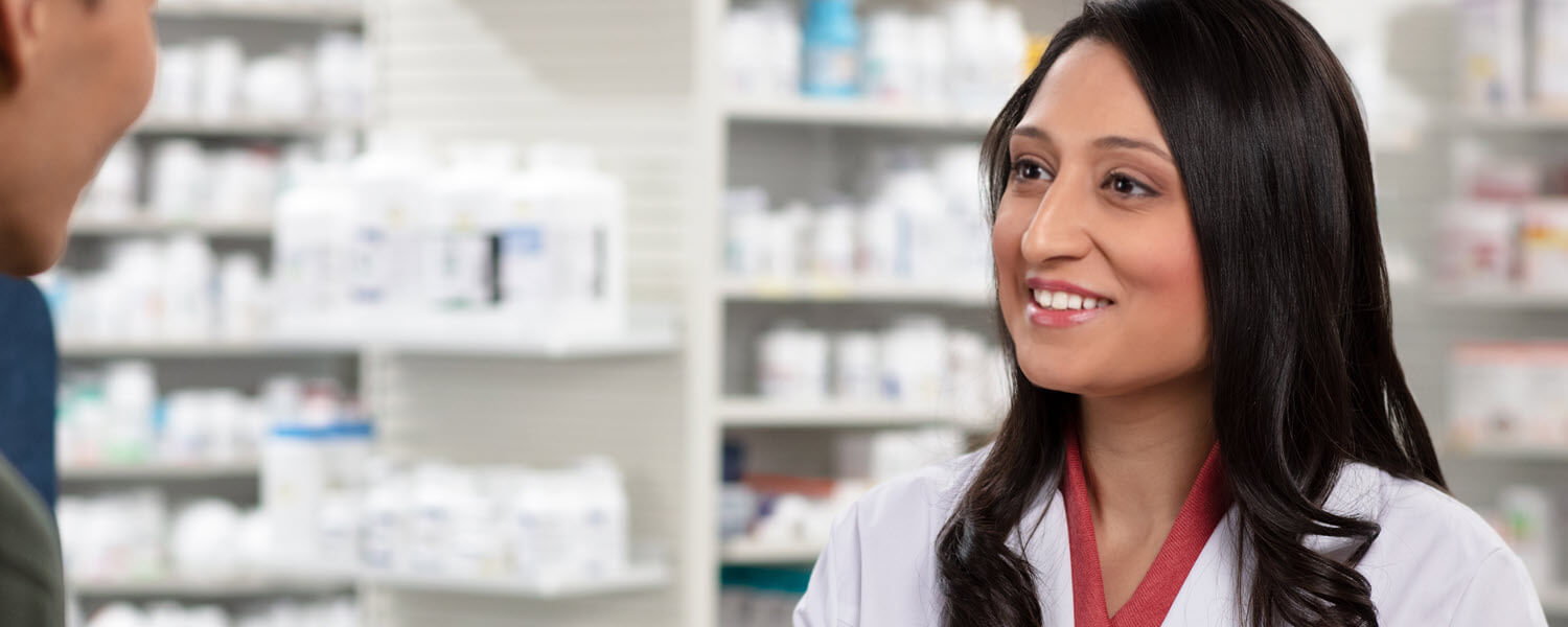 Pharmacist greeting customer