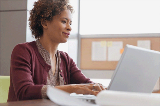 Woman working on a laptop. 