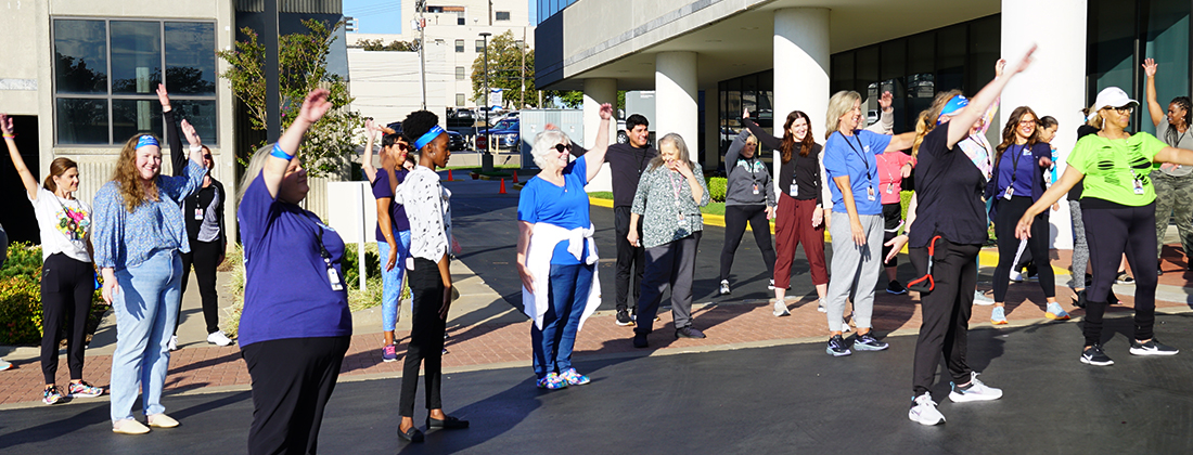 Employees doing an outdoor exercise class