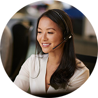 Woman working in a call center with a headset on.